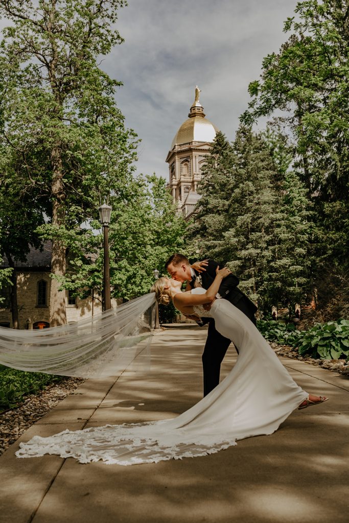 portrait with the golden dome at this wedding at Notre Dame