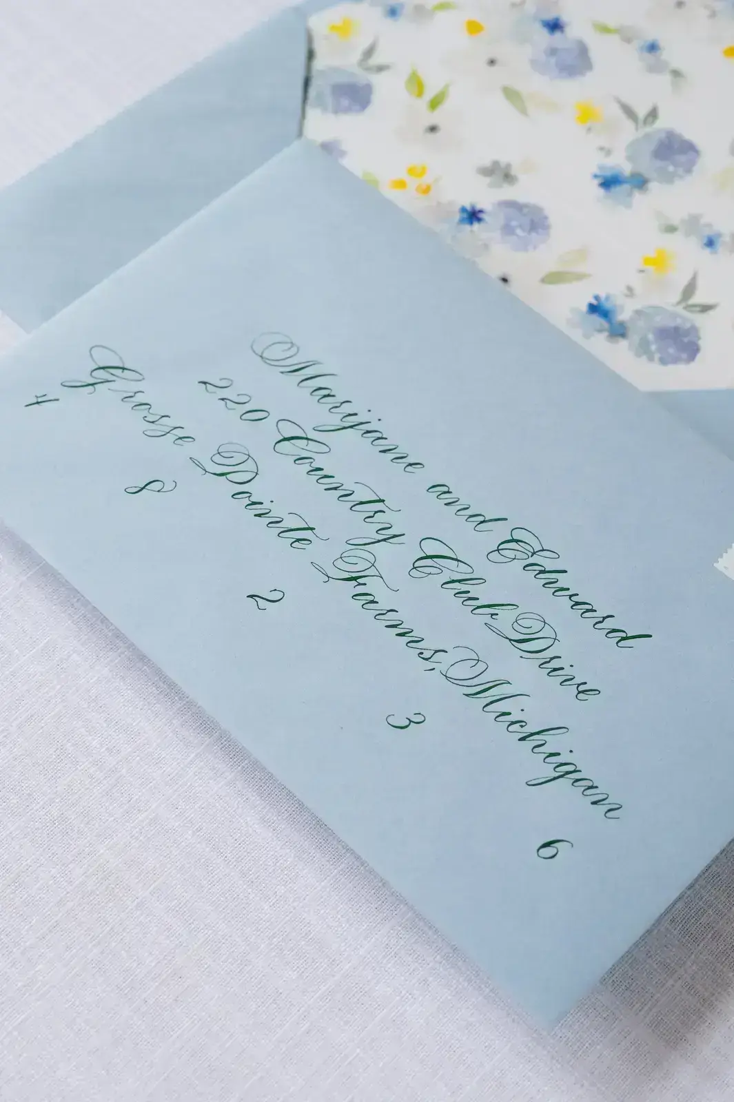 traditional envelope calligraphy on a unique wedding invitation