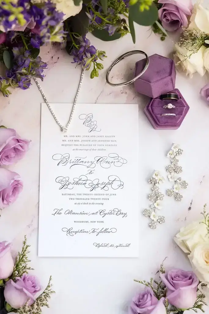 purple wedding invitation with jewelry - Leah E. Moss Designs