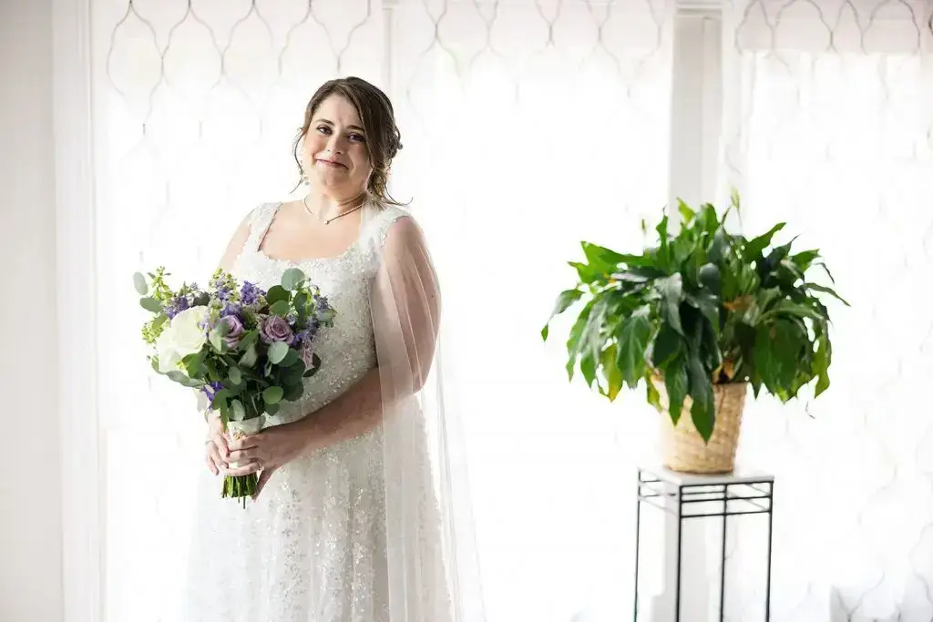 bride with purple bouquet