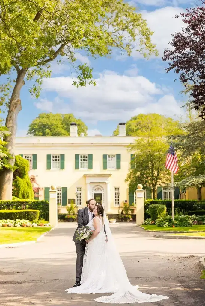 bride and groom in front of Mansion at Oyster Bay - from Leah E. Moss Designs