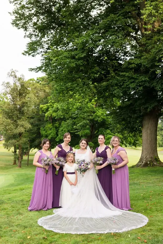 bridesmaids in various shades of purple at this Mansion at Oyster Bay wedding - from Leah E. Moss Designs
