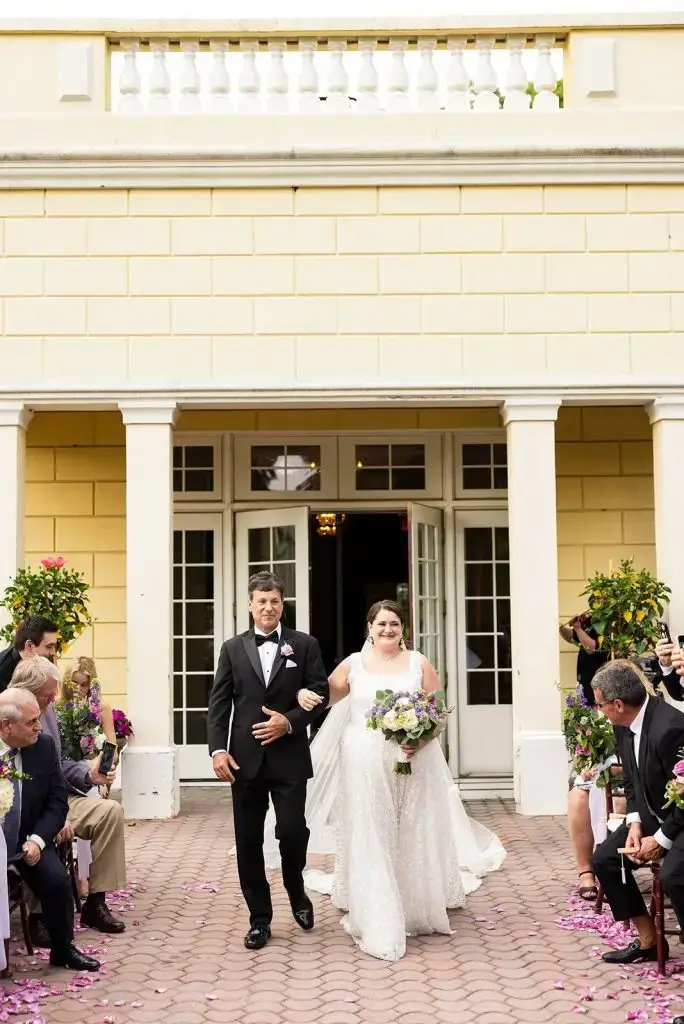 bride walking down the aisle with her father at Mansion at Oyster Bay wedding - from Leah E. Moss Designs