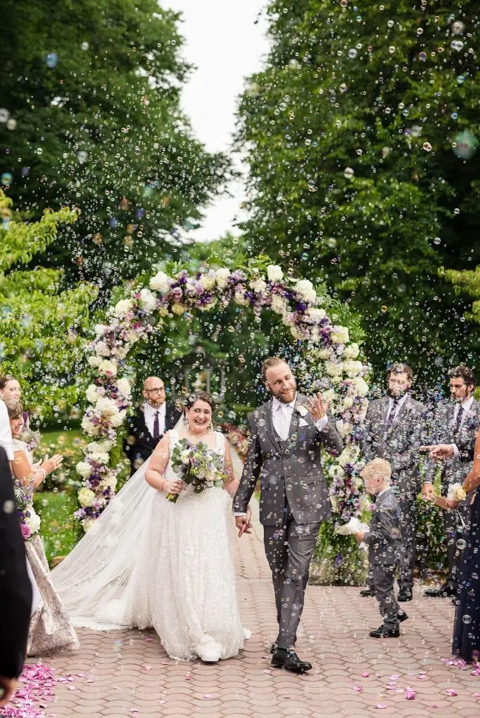 bride and groom recessional with bubbles - Mansion at Oyster Bay wedding - from Leah E. Moss Designs