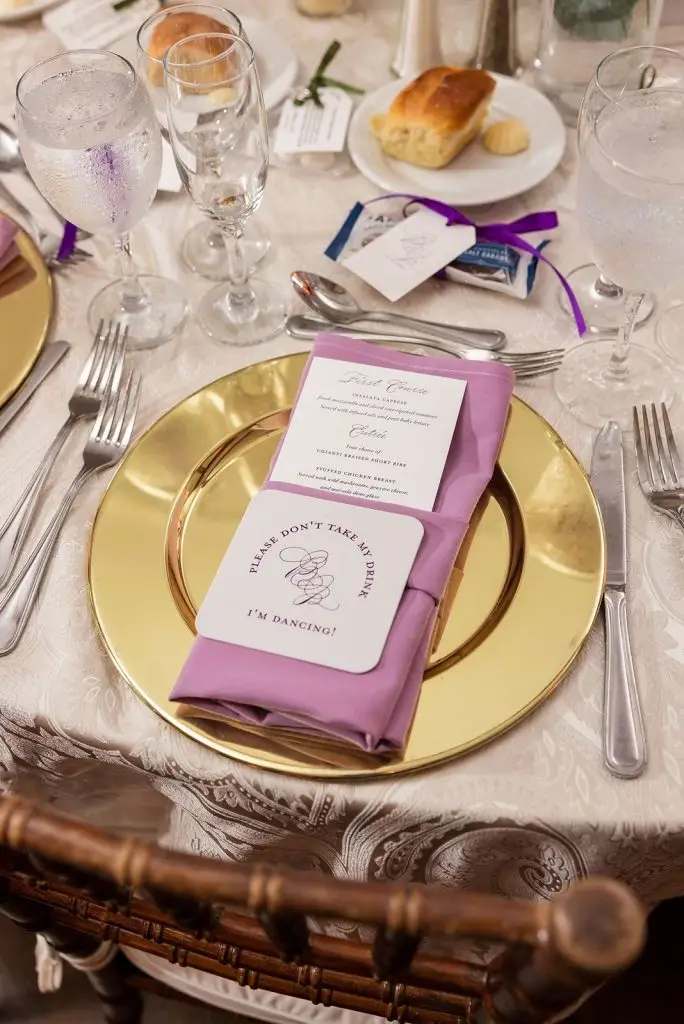 purple menu and drink cover with a gold charger - Mansion at Oyster Bay wedding - from Leah E. Moss Designs
