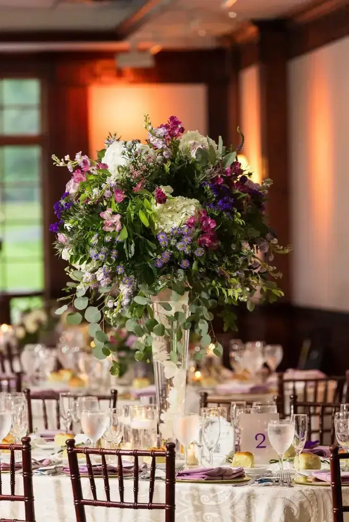 purple floral centerpiece from a Mansion at Oyster Bay wedding - from Leah E. Moss Designs