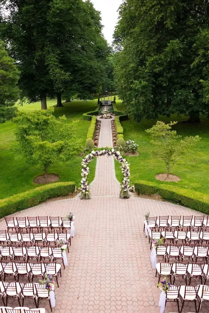 outdoor ceremony setup at a purple Mansion at Oyster Bay wedding - from Leah E. Moss Designs