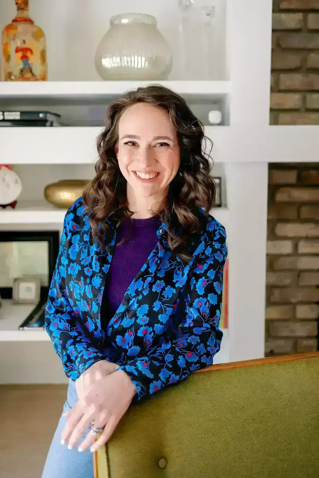 detroit wedding invitations designer stands behind a chair