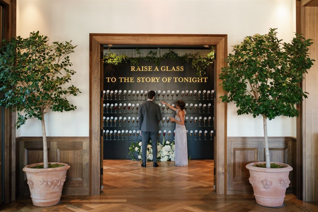 champagne seating chart wall at a Book Tower wedding