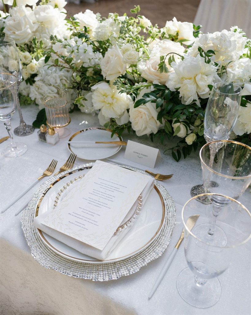 menu with white and gold table setting at a Book Tower wedding