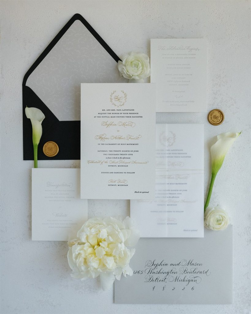 black, white, and gold book tower wedding invitations