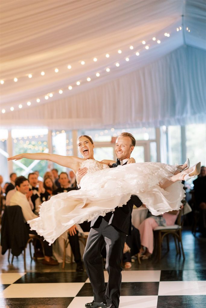 The Abbey Resort wedding reception - groom twirls bride during first dance