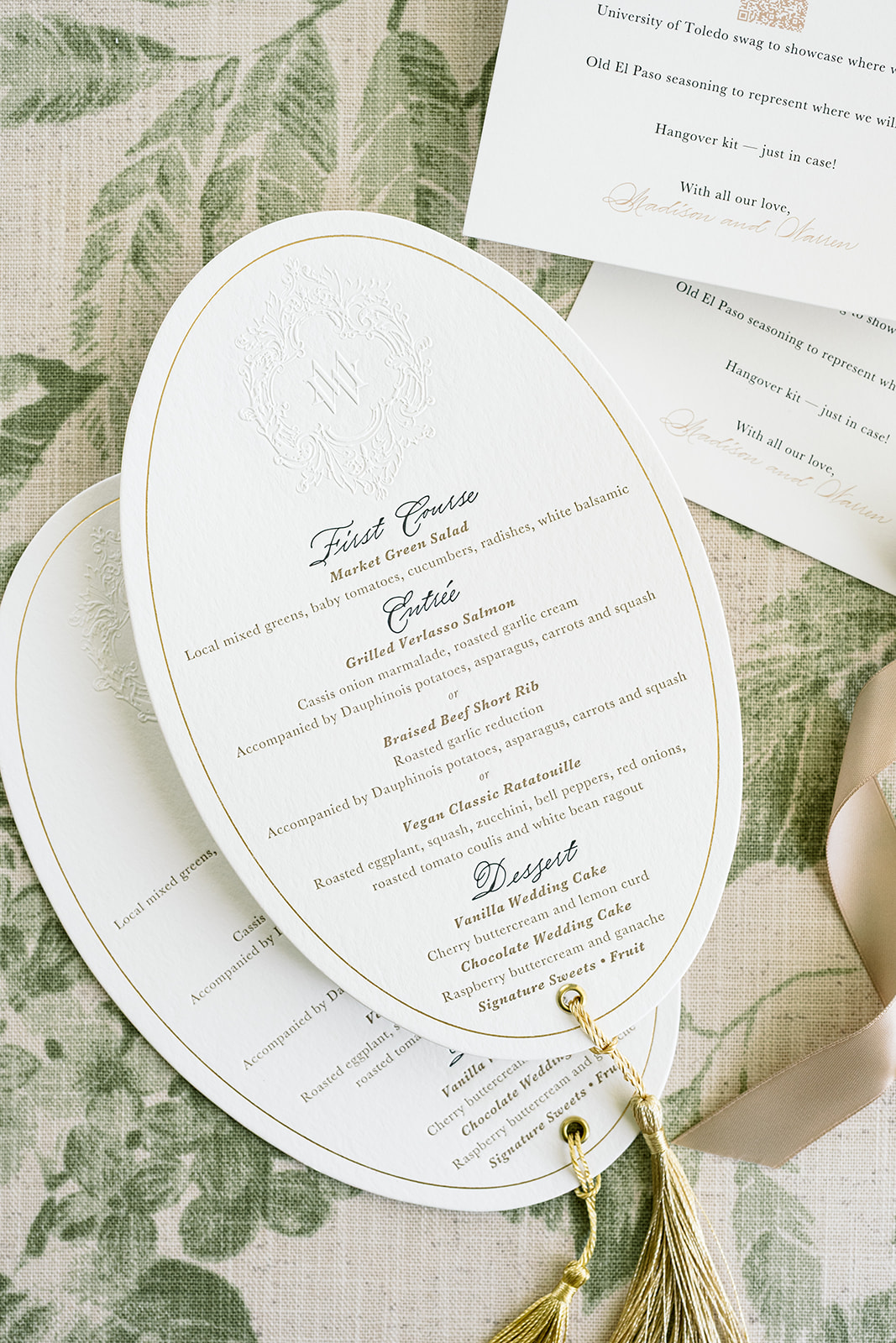 embsossed, letterpress, and foil stamped menus for wedding with gold tassel