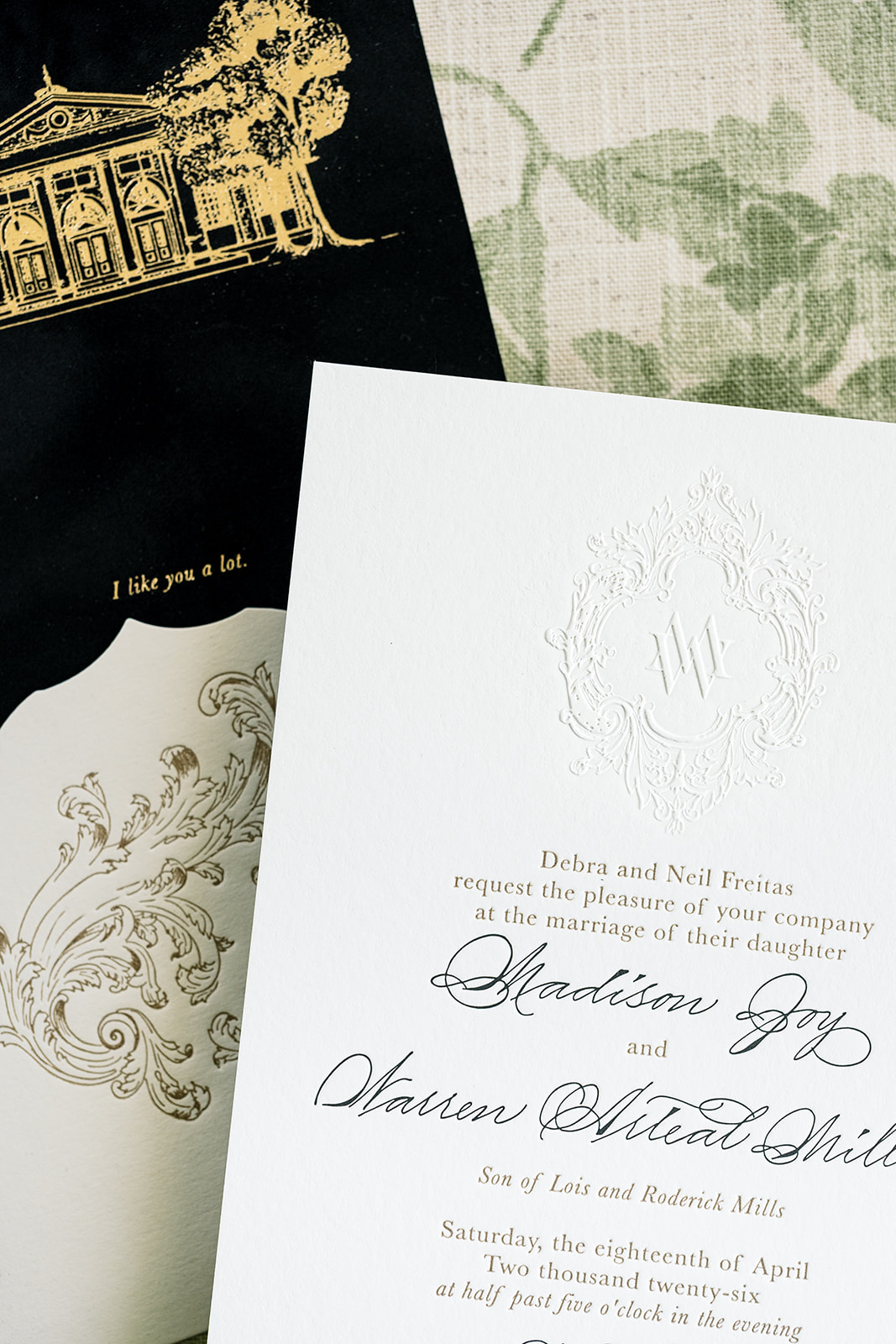 embsossed monogram on main invitation with velvet backer makes for a unique wedding invitation